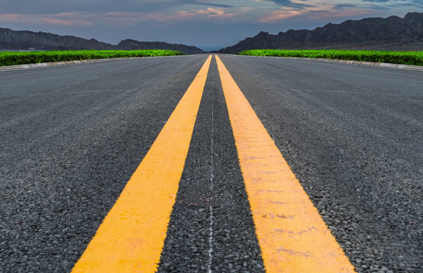 a close up of two yellow road stripes